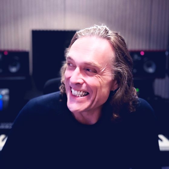 Nicholas Gunn headshot – ambient and electronic music producer, melodic chill and cinematic artist on Blue Dot Music.